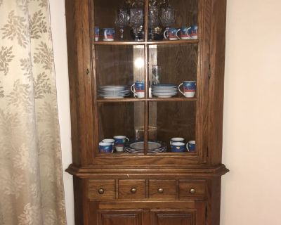 Beautiful oak corner China closet. $350. Excellent condition. Located in Ocean Pines