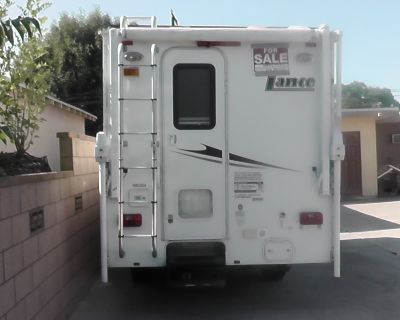This camper has only been used about 10 times, for 3 or 4 days each time. It has always been in the shade and has few defects. It has air conditioning, a stove, a shower, and a water heater. The price is for the camper only. The pickup is not for sale.