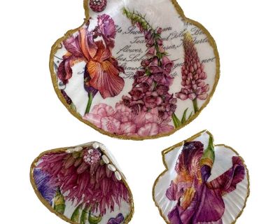 A refined trio of natural seashells, each transformed into an art piece through delicate hand Decoupage, and guild detail. The rich botanical t es evoke, timeless, beauty, and sophistication. Each shell is hand, trimmed in metal gold, creating a staining contrast with the soft pearlescent interior. Perfect as jewelry holders, decorative accents, or thoughtful gifts! Elegant displays on a vanity...