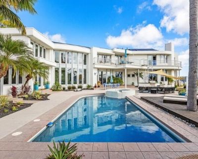 4628 Rancho Reposo. Fully furnished home located in Rancho Del Mar, perched atop a hill with sweeping, unobstructed views of the valley and distant vistas. This stunning home showcases beautiful, unique architecture and walls of windows that fill every space with natural light. The dramatic, curved staircase makes a striking first impression, leading to open, airy living spaces designed for bot...