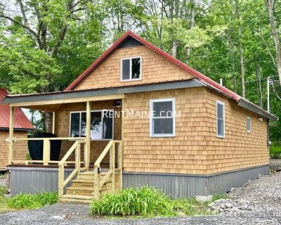 8 Sand Beach Ln. "The Retreat". Available Now - Lakeside Cabin on Lake Winnecook Burnham, ME - Cozy cabin features a fully equipped kitchen; - Inviting living/dining space with beautiful waterfront views; - Two comfortable sleeping areas a queen bedroom on the main floor and an open loft with a second queen bed. - Amenities include a private beachside firepit, propane grill, kayaks with paddles...