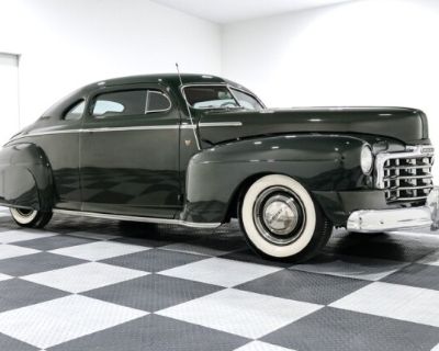 When Mercury rolled out the Eight in 1947 it was a statement of postwar optimism, big, bold, and dripping with chrome. But this one? It takes that classic appeal and gives it a kick in the teeth with a hot rod attitude that can't be ignored. The deep green paint glows under the light, contrasted by subtle custom pinstriping and that unmistakable chop top that lowers the roofline just enough to ...