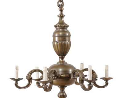 A French bronze chandelier with six lights from the mid 20th century. This vintage chandelier from France features a dark, nicely patinated bronze body. The central gallery is made up of two rounded sections, the upper more oblong, with fan and dot motif, and the central gallery, which is more bulbous, supporting the six arms and projected finial accent below. Six S-style bronze arms extend out...