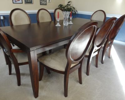Excellent Condition 9 Piece Dining Room Table and Chairs: solid wood table, heavy wood chairs with clean fabric, 6 standard chairs and 2 arm chairs. Smoke free home and moving to a house that does not have a formal dining room. This set is only 8 years old and rarely used. Measurements: 90in x 44in with leaf. The leaf is 18in. $1050 Or Best Offer. Please call/text 757-375-0165.