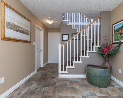 MLS No: 1014249 - $1,699,980 Welcome to the private and sought-after Knockan Hill community! This beautifully maintained 6-bedroom, 3-bathroom home offers a rare blend of space, elegance, and versatility, perfect for families or investors. The main home features a triple-car garage with tons of parking and high-end finishings throughout. On the lower level, you ll find a spacious entry, a versa...