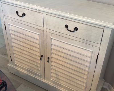 Distressed look white entry/hallway cabinet has some bubbling in paint in top as shown otherwise in good condition. Wood based. 41 x 14 1/2 x 36 . Local pick up. Delivery available by a third party for a min $100 depending on location and floor
