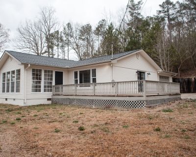 1275 Gravel Ridge Rd #1. $300 OFF FIRST MONTH'S RENT!Welcome to this beautifully renovated 3-bedroom, 2-bathroom home with a 2-car garagedesigned for you and your loved ones to make lasting memories! Enjoy cozy nights by the fireplace or relax in the peaceful setting on your very own wrap-around deck. The updated kitchen features stainless steel appliances (range, microwave, and dishwasher), gr...