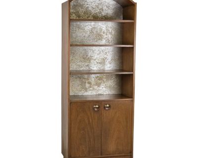 Walnut Mid Century Arch Top Bookshelf Or Display Case. Featuring Adjustable Shelving, 2 Tone Metal Accent Back Panel & A Spacious Cabinet Below. This Beauty Is Ready To Turn Heads In Your Home. *I Have A Trio Of these Available, All Listed Individually*. Dimensions 30.5 W 16 D 78 H Styles Mid-Century Modern Brand Founders Furniture Company Designer Jack Cartwright Period 1960s Country of Origin...