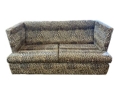 Featuring a dramatic high back and sculptural shelter arms, this piece seamlessly blends glamorous allure and cozy comfort. The plush, deep seats invite relaxation, while the striking leopard motif makes an unforgettable centerpiece.. Dimensions 78 W 38 D 36 H Styles Mid-Century Modern Number of Seats 3 Arm Height 36.0 in Seat Height 17.5 in Period 1970s Country of Origin United States Item Typ...