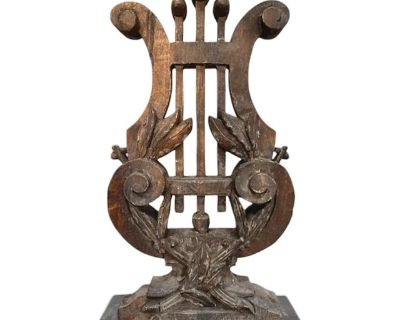 A charming, carved wood architectural piece. Features a vintage style, carved wood lyre/harp on an iron base. Lisa Luby Ryan Collection for Arteriors.. Dimensions 10 W 4 D 16.5 H Styles Gustavian (Swedish) Rustic European Traditional Brand Arteriors Home Period Early 21st Century Country of Origin India Item Type Vintage, Antique or Pre-owned Shop Sustainably with Chairish Materials Wood Condit...