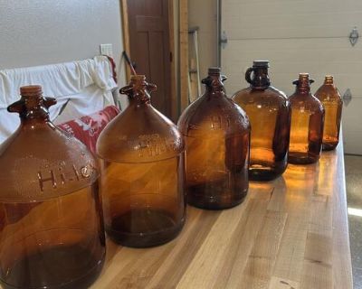 Antique amber colored Hi-lex and Purex glass jugs.