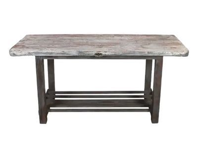 A Rustic Work Table With Lower Shelf