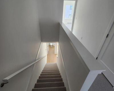 This stunning 3-bedroom, 3-bathroom townhome offers luxury living in a prime central location. Featuring brand new, high-end finishings throughout, this spacious home includes a chef s kitchen with stainless steel appliances, contemporary cabinetry, and elegant countertops. Enjoy the comfort of an open concept living area, perfect for entertaining or family living. Located just minutes from May...