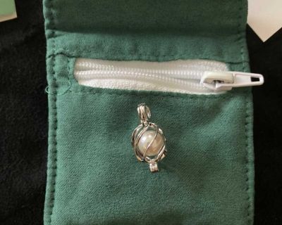 Real pearl in sterling silver cage