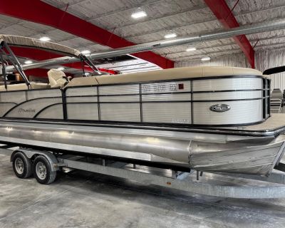 With only 220 hours of use, this impressive 25-foot Tritoon is powered by a robust 250 HP Suzuki four-stroke outboard. It features an SHP package, power assist steering, an in-floor ski locker, a full cover, a ski tow bar, and a digital touchscreen with navigation map. The boat also comes with a Bimini top and lifting strakes for enhanced performance. Please note that the price does not include...