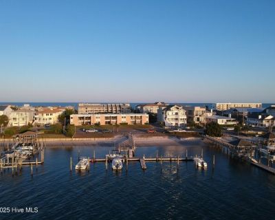 624 Waynick Blvd Unit 101. Waterfront 1BR at Banks Channel Condos for $2,450/month, offering west-facing sunset views and immediate access to both the channel and the beach, with Crystal Pier just steps away. Enjoy dock access (no boat slip), on-site laundry, off-street parking for one car, and included trash and water. The home is currently unfurnished (photos show furnishings) and the propert...