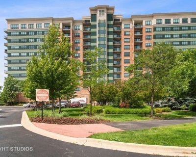 6420 Double Eagle Dr Unit 801. Stunning view overlooks golf course. Kitchen has maple cabinets, granite counters, stainless appliances, upgraded light fixtures, refrigerator and range. In-unit laundry. Upgraded carpet padding throughout. Master bath with separate shower and soaking tub. 2 extra parking spaces. Building has 24-hr doorperson, pool, party room, elegant lobby. Near cinema, shopping...