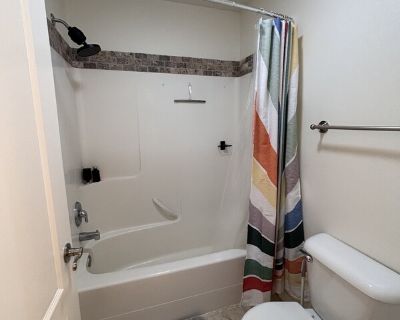 We live in a quiet cul de sac with a spacious, bright house. This is perfect for a traveling professional looking for a place to call home while on a work assignment. We have two well-behaved dogs that stay at a dog sitter during weekdays. The bedroom comes fully furnished; you can access laundry and a shared kitchen and living space. . 1 Bedroom. 1 Bathroom