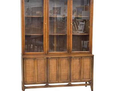 Beautiful Mid Century One Piece Hutch/Display Cabinet Now Availble & Ready For Your Favorite Pieces! Featuring Cane Front Paneling On The Base & 3 Levels For Display Behing The Double Glass Doors.. Dimensions 52 W 16 D 71 H Styles Mid-Century Modern Period 1960s Country of Origin United States Item Type Vintage, Antique or Pre-owned Shop Sustainably with Chairish Materials Caning Glass Walnut C...