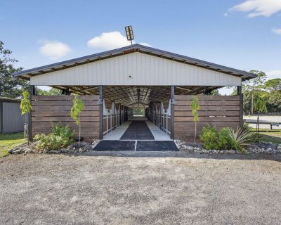 14346 Tripp Road N. Great Location Equestrian Facility 17 Stall Barn,12 x 12 Matted Stalls, Fans, Automatic Water, Air-Conditioned Lounge and Tack Room, Feed Room 36 x 14, Laundry Room with Washer and Dryer, Bathroom, 2 Grooming Stalls, 3 Wash Stalls, All Weather Lighted and Irrigated Riding Arena 200 x 120, Jump Course, Pavilion Area overlooking the Arena, 9 Grassy Paddocks, Plenty of Parking,...