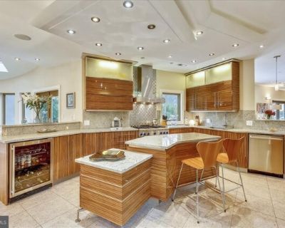 6600 80th Pl. This beautifully designed 6BR with 5 full/2 half baths contemporary home is AMAZING and has plenty of rooms for customized use. With over 6500 sq. ft. of finished space and luxury finishes throughout, you'll never want to leave! As soon as you enter you'll see the two-story foyer and the open layout is very inviting as it's bathed in natural light. The top floor hosts 4 spacious b...