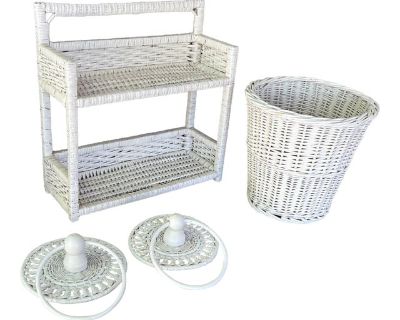 This charming white wicker bathroom set evokes a sense of nostalgia with its intricate craftsmanship. Perfect for adding vintage elegance to your space. Shelf measures 16.5"x16"x6" with two storage tiers Wastebasket dimensions: 11"x11" Towel rings have a 7.5" diameter Sturdy woven wicker construction Classic white painted finish *This item is vintage and may show signs of wear consistent with i...