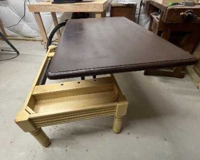 Coffee table that converts to a table while sitting on the couch eating a meal. With storage space for remotes and other small items. Farmhouse style. 46" x 28" x 18" tall.
