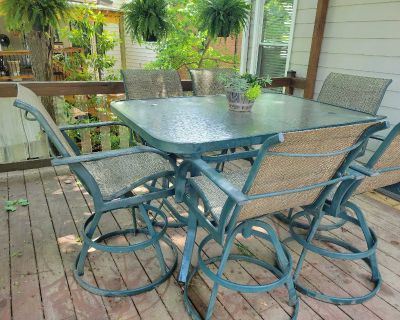 Glass patio table with six chairs