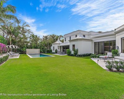 El Vedado Road. Stunning Palm Beach classic Regency estate with library, 7 bedrooms, 9 baths, and powder room. Beautiful marble and hardwood finishes throughout. Sunny and bright interiors with high ceilings. Oversized living room opens to immaculately landscaped backyard with spa and lap pool. Gourmet kitchen attaches to family room with open terrace. Serene Primary Suite features dual baths a...