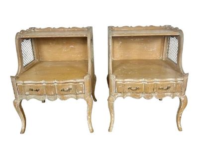 Pair of early 20th century two-tier side tables with drawers and iron grate insets on sides. The tables stand on four cabriole legs. Weathered finish with paint remnants left throughout. Great dove tailing on drawers. Original brass hardware.. Dimensions 22 W 20 D 29 H Styles French Neoclassical Table Shape Rectangle Period 1930s Country of Origin France Item Type Vintage, Antique or Pre-owned ...