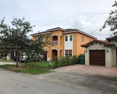 SW 177th Ter. Spacious 5-bedroom, 4-bathroom two-story home featuring two master suites. This beautiful rental includes a separate bedroom and bathroom downstairs, a modern granite kitchen with a long breakfast bar, and a convenient laundry room on the first floor. The second floor is built with concrete for added soundproofing.\r\n\r\nAdditional features include two high-efficiency central A/C...