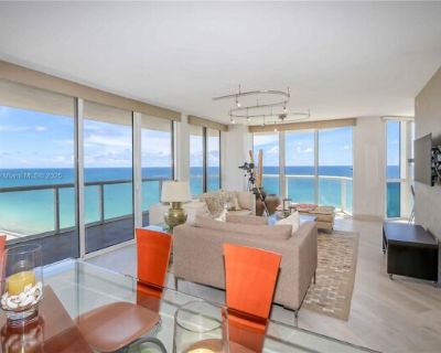 6365 Collins Ave Apt 2401. Indulge in the epitome of oceanfront luxury with this fully furnished 3-bedroom, 2.5-bath residence featuring breathtaking direct ocean views and an expansive wraparound balcony overlooking the pristine waters of Miami Beach. Thoughtfully designed, this spacious home offers porcelain wood-style flooring, modern closet doors with custom built-ins, designer lighting, an...