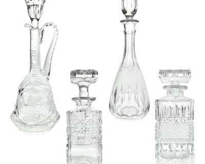 1970s Vintage Set of 4 Wine Spirits Liquor Crystal Decanter Set, Barware Excellent condition. No chips, cracks, or fleabites. One decanter has interior fog and will need extra cleaning. Tall Ewer Wine Decanter w/Handle Height 14 3/8 Holds 30oz Tall Bulbous Wine Decanter Height 14 Holds 32oz Short Square Spirits Liquor Decanter Height 8 3/4 Holds 20oz Slightly Shorter Square Spirits Liquor Decan...