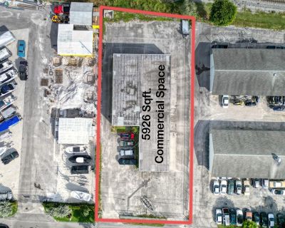 Coral Street. Half-acre secure fenced all paved lot with a free standing 5926' concrete warehouse building. Five 12' tall grade level overhead doors on 3 sides of the building. 13' ceilings . Commercial CS zoning. Institutional and public facilities district. Excellent central South Florida location in east Hypoluxo. Only five minutes to I-95. All sizes are approximate.