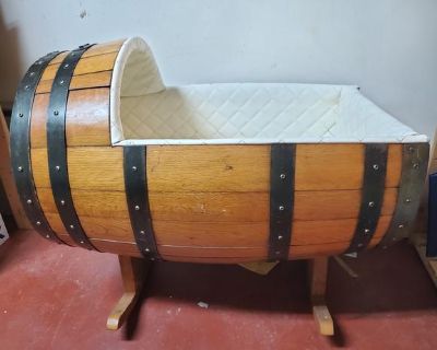 One-of-a-kind baby cradle made from a vintage whiskey barrel