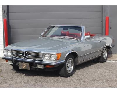 Odometer: 9328. A 1972 Mercedes Benz 350SL roadster R107. Silver grey with a red interior. 97,000 original miles. Two tops. A very nice and straight body, rust free undercarriage. The original paint has some blemishes and fading by the trunk area but looks nice overall. Good chrome all the way around. The original interior is all there but showing its age but there are no cracks on them, black ...