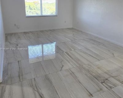 SW 196th St. The listed price already reflects a rent credit equal to one month free, prorated over a 12-month lease. The original rent is $2,125, but the displayed price includes the promotional discount. Spacious and well-maintained 2-bedroom, 1-bathroom apartment in a gated community. Rent includes water and high-speed Internet/Wi-Fi. The unit offers 2 unassigned parking permits, access to a...