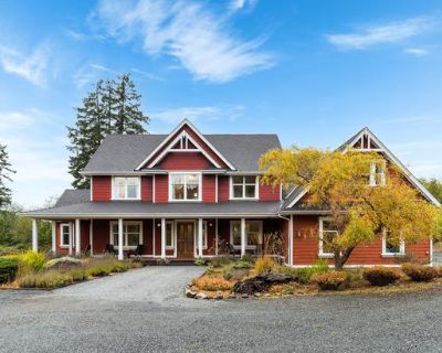 Living in a valley surrounded by mountain tops. Rare 5-acre Shawnigan Lake estate with sweeping mountain views from two private residences totalling 6,700+ sq. ft. The 4,000+ sq. ft. Luxury primary residence blends West Coast warmth with refined comfort, vaulted ceilings, expansive chef s kitchen, stone fireplace, and designer lighting anchor the main level s Living, Dining, Family, Kitchen, De...