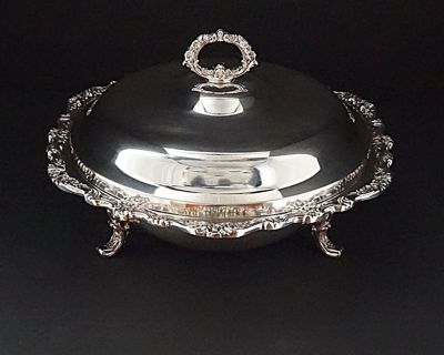Vintage (c1968) silver-plated three-footed food serving bowl and lid with ornate Victorian style border, feet and handle design