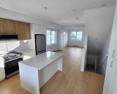 This stunning 4-bedroom, 3-bathroom townhome offers luxury living in a prime central location. Featuring brand new, high-end finishings throughout, this spacious home includes a chef s kitchen with stainless steel appliances, contemporary cabinetry, and elegant countertops. Enjoy the comfort of an open concept living area, perfect for entertaining or family living. Located just minutes from May...