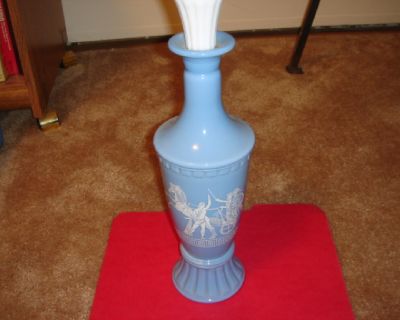 Beautiful Greek motif designed porcelain bottle with white porcelain top.  Excellent condition.  Over 40 years old.  Identification markings are on bottom of bottle.