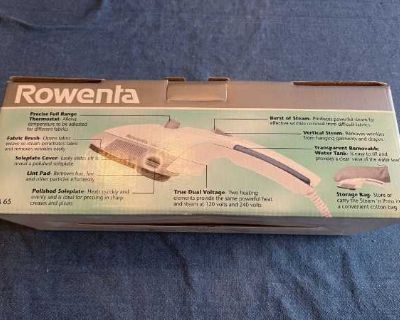 Rowenta Steam & Press Steambrush. Never been used. Has thermostat, fabric brush, lint pad, steam burst, storage bag. See photos.