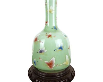 Chinese porcelain butterfly yaolingzun. A finely formed, mallet shape vase with a bean glazed exterior and a white glazed interior and inset base. The top rim is accented with a gold band, the neck and body of the vase is decorated with finelt drawn and detailed polychrome butterflies. The body ends in a sloping, slightly concave foot with a narrow unglazed lower rim accented with thin ringlets...