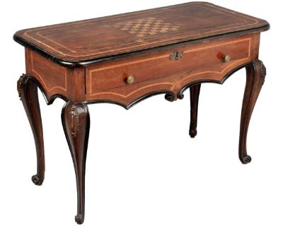 An 18th century Italian Louis XV style center table or console from Torino. Bold design made from thick planks of solid walnut with ebonized trim and finished an all for sides so that it may be free-floated in a room. Curved cabriole legs with carved details and large apron with inlaid decoration. Deep dovetailed drawer with brass knobs and escutcheon, working lock but no key. Top has curved co...
