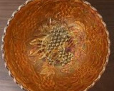 Nine inch orange carnival glass bowl Imperial Marigold Grape pattern.