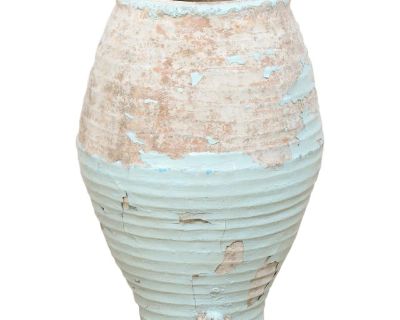 A Spanish clay jar with glazing from the 19th century. This antique terracotta vessel from Spain has a beautifully bulbous shape, nicely ribbed texture, and rests upon a flattened base. The jar stands approximately 2.75 feet in height and has a single spout which projects out just above it's base. Remnants of light blue glazing are found throughout, and there is a fabulously weathered patina wh...
