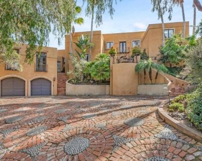 136 Hummingbird Hl. Nestled on a half-acre hilltop lot in Olivenhain, this exceptional Modern-Inspired Italian Villa offers privacy and captivating Rancho Santa Fe views, treating you to inspiring sunrises, evening glow, and valley lights year-round. Step in the front door onto the beautiful Hickory hardwood engineered floors and immediately see the view through the expansive 20' Marvin glass s...