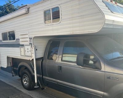 This listing is for a very clean 2003 FORD F-250 Super Duty Super Cab Truck with 5.4L V-8 Engine (2WD) with Super Cab and also has a 2001 Elkhorn Camper. Clean title, no accidents. Two owners. Running great and perfect for someone looking to get on the road or who wants a truck they can sleep in. State smog inspection passed a few days ago and tags are up to date. Truck Features 1. 75,850 miles...