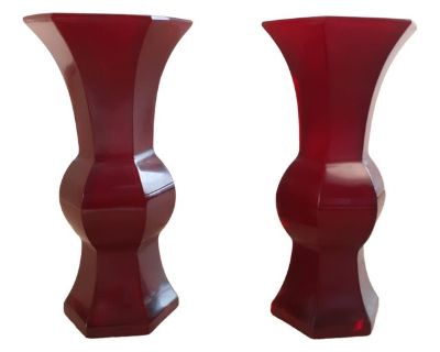 A pair of Chinese, ruby red, Peking glass gu , a finely formed, matched pair of beaker shape vases with a deep, translucent, ruby red color. Very reactive to different lighting conditions. Both vases have a four character, Qianlong, reign mark within a square incised to their round, inset bases. Circa early 20th century, no later than mid century. each vase: 7.25" high x 3.75" wide x 3.25" deep...