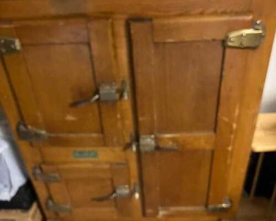 Antique ice box, antique dresser and chair.